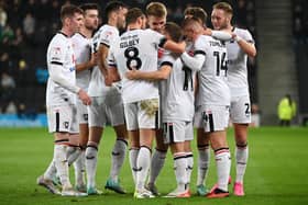 MK Dons celebrate Jack Payne’s goal against Bradford City