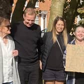 The protestors pictured after their victory in saving two mature trees from being chopped down in Newport Pagnell today