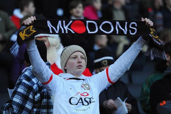 A young MK Dons fan looks on during the FA Cup match between MK Dons and AFC Wimbledon at StadiumMK on December 2, 2012.